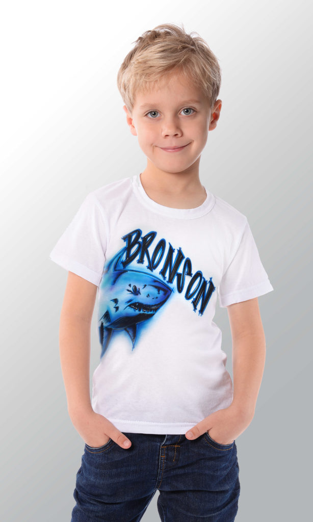 Boy Bronson wearing a custom airbrushed shark t-shirt in blue shades and black color.