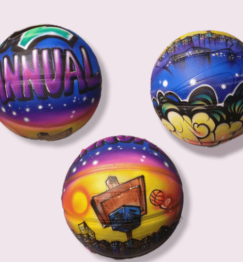 Colorful Nike basketball with NYC graffiti style in yellow, purple, blue, pink, and white colors